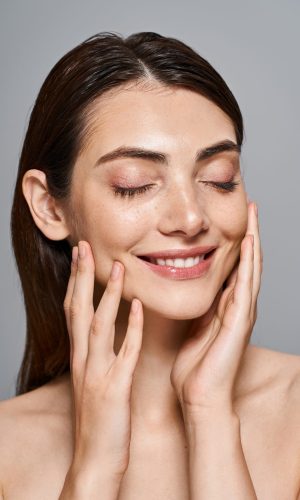 A,Young,Caucasian,Woman,With,Brunette,Hair,Smiles,Brightly,While